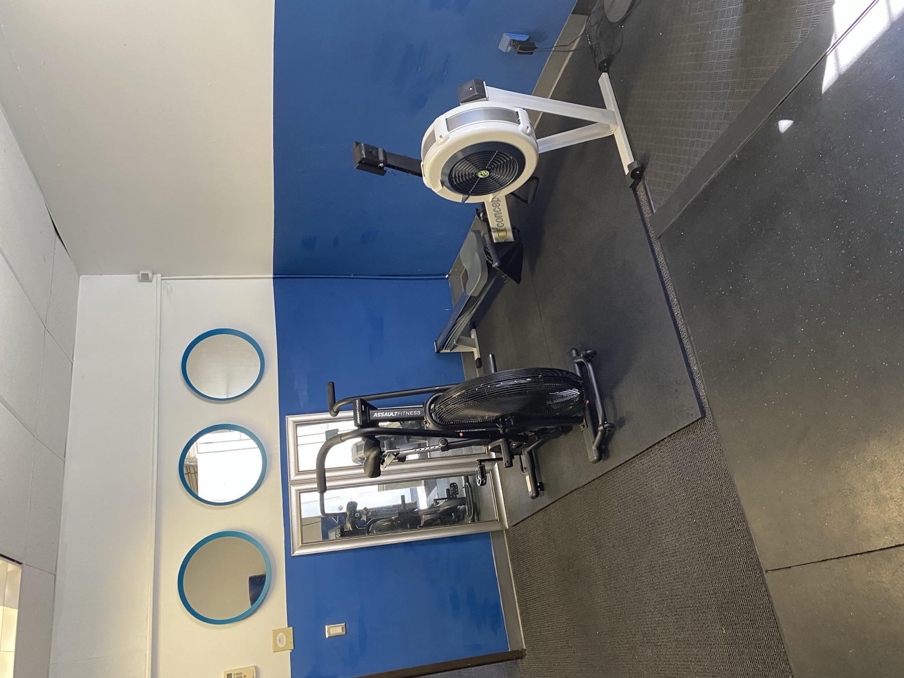 Air bike and rowing machine inside K2’s personal training studio in Fremont